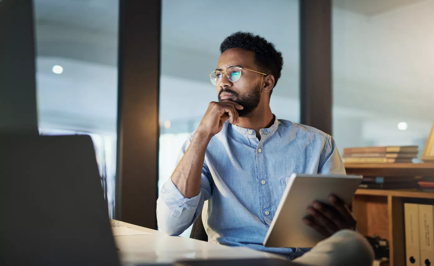  man sitting looking at computer
