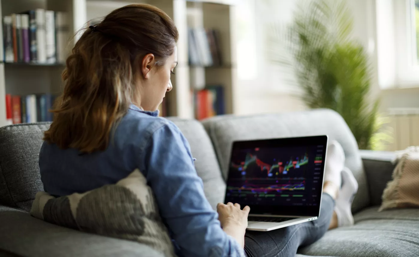  Woman on couch looking at laptop
