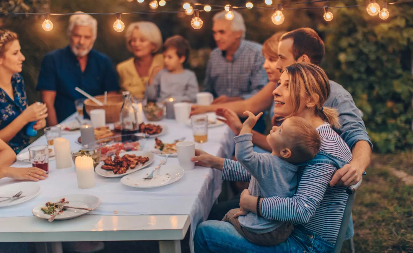  Family having dinner outdoors
