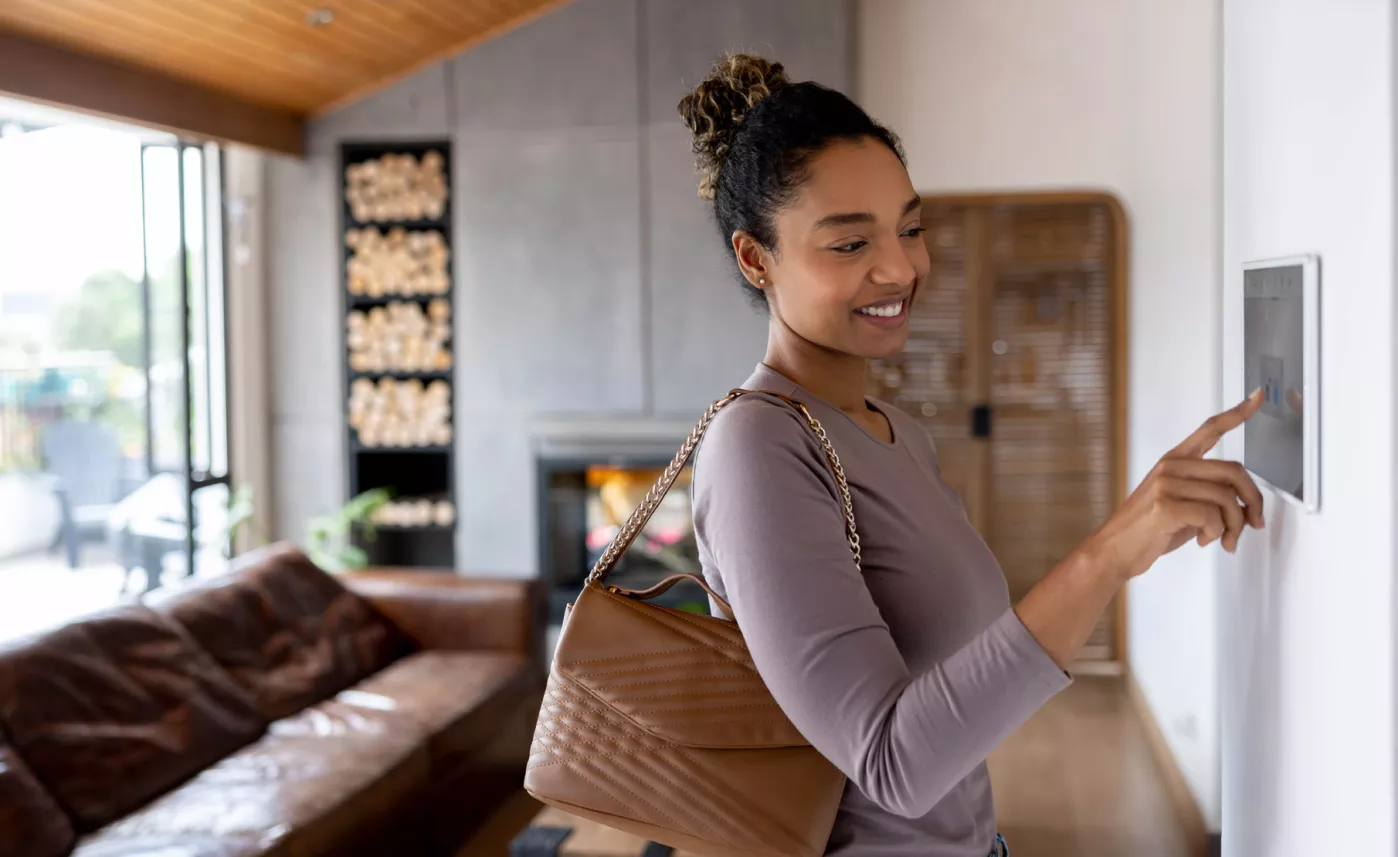 A young woman using technology in her home