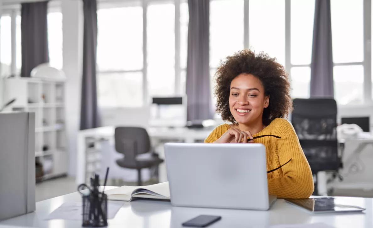  An Edward Jones client reviews her investments portfolio on her laptop.
