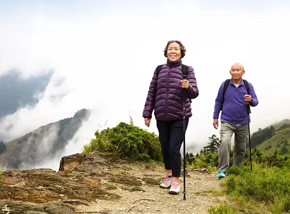  An old couple walking on a trek
