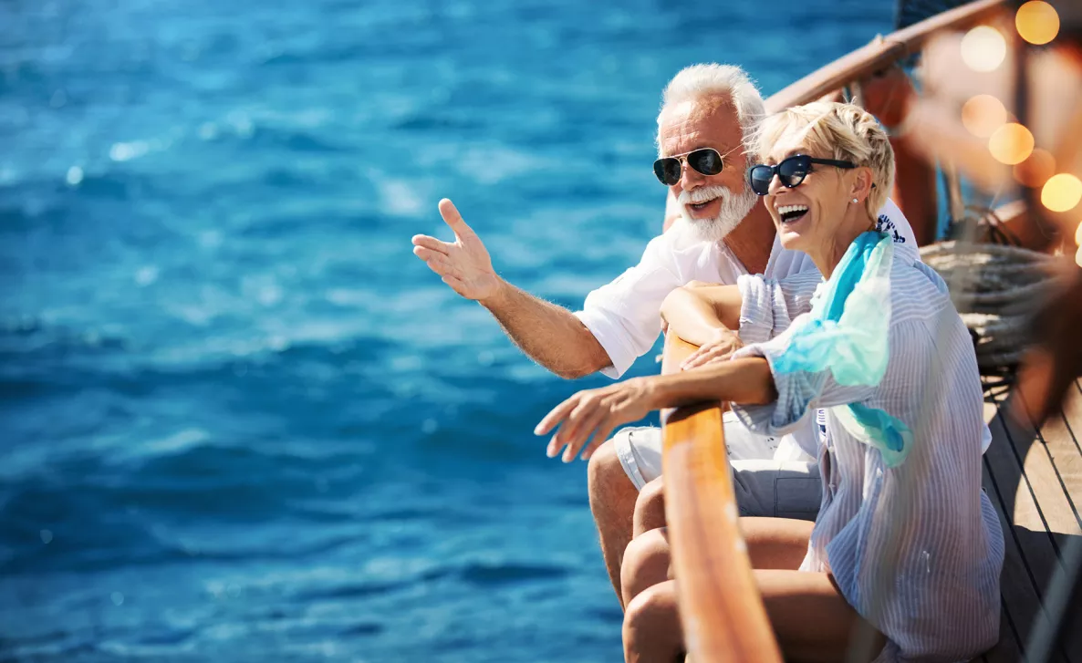  Couple on the deck of a boat in the ocean
