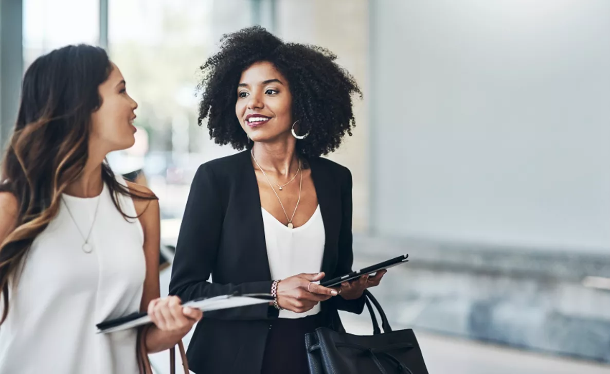  Two business women walking
