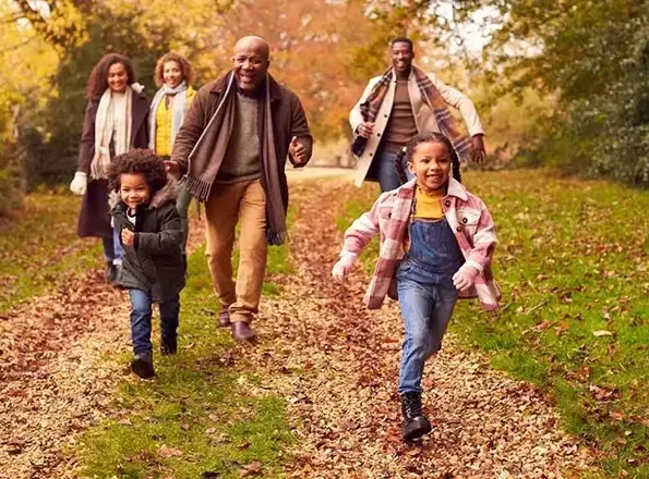  A family with kids walking in a park
