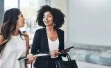 two woman talking to each other