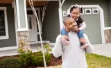 A man with his daughter on shoulder
