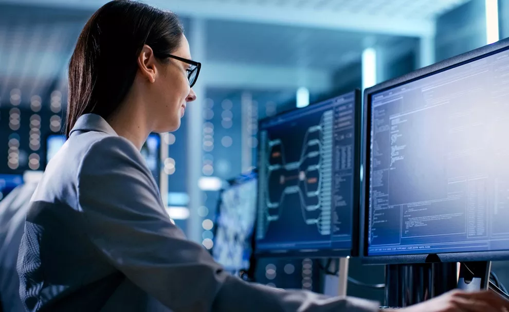 A woman looking at monitor and ensuring privacy and security